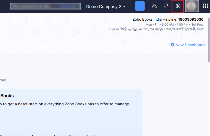 Zoho Books dashboard with the settings icon highlighted in the top-right corner.