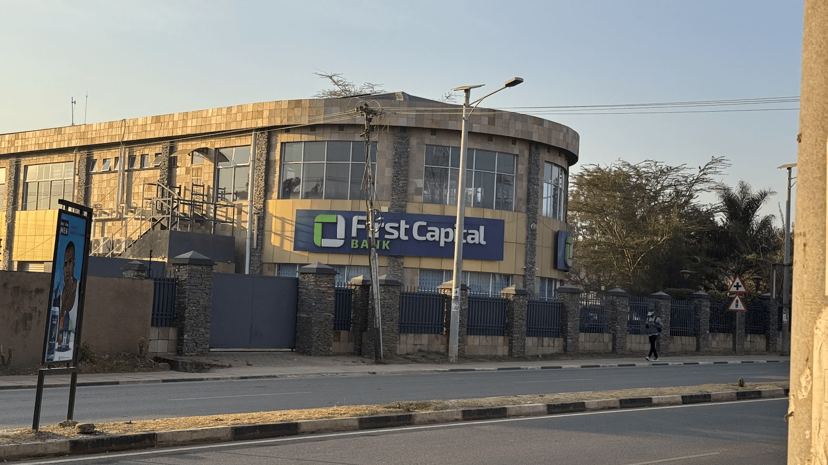 Exterior view of First Capital Bank branch building showing modern architecture along a city road
